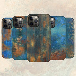 May include: Four phone cases with a blue and brown rusty metal design. The cases are all different shades of blue and brown.