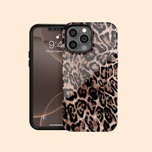 May include: A black phone case with a leopard print design. The case has a clear back and a black frame. The phone case has a cut-out for the camera lens and a cut-out for the charging port.