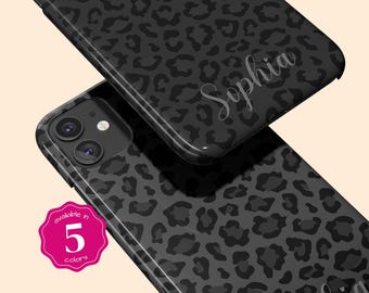 May include: Two black smartphone cases featuring a dark gray leopard print pattern. One case displays the name Sophia in a white cursive script. A pink scalloped badge on the lower left corner contains the white text available in 5 colors.