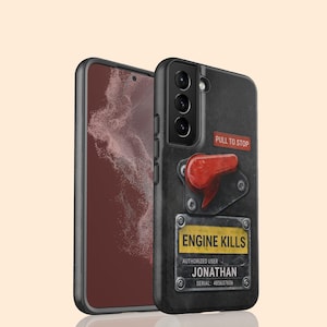 May include: Black phone case with a design resembling an engine control panel. It features a red lever, the text "PULL TO STOP", and a yellow label that reads "ENGINE KILLS". The name "JONATHAN" and a serial number are also visible.