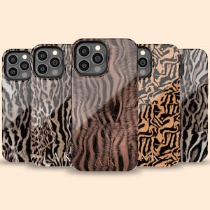 May include: Five different phone cases with a brown and black animal print design. The cases are all for the same model phone and have a clear, glossy finish.