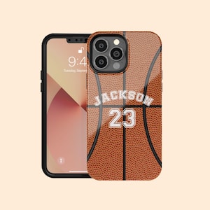 May include: A brown and orange basketball phone case with a white basketball design and the text "JACKSON 23".