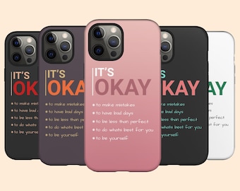 May include: Five different phone cases with the text "It's Okay" and a list of reasons why it's okay to make mistakes, have bad days, be less than perfect, do what's best for you, and be yourself.