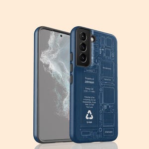 May include: A dark blue smartphone case featuring a white technical blueprint design of internal components. The text reads Property of Johnson, Energy Cell 3.79V-11.16Wh, Potential of fire or burning, Do not disassemble, Crush, Heat, Or Test Your Luck.