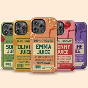 May include: Five phone cases with juice box designs. Each case features a different color and juice name: green "Soi Juice", yellow "Olivi Juice", orange "Emma Juice", pink "Enny Juice", and purple "Ine Ice". The cases have fruit illustrations and text.