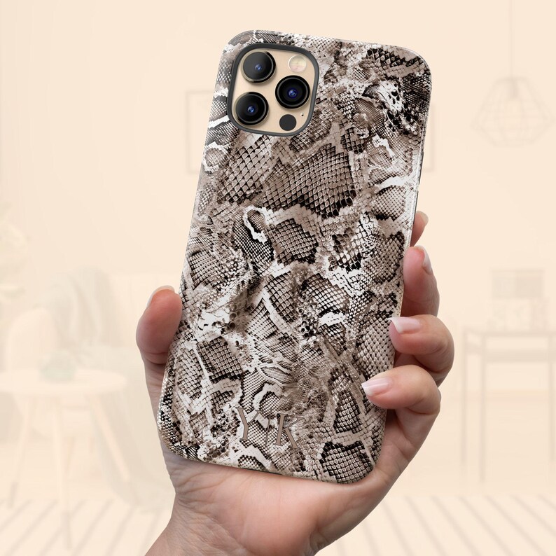 a person holding a phone case in their hand