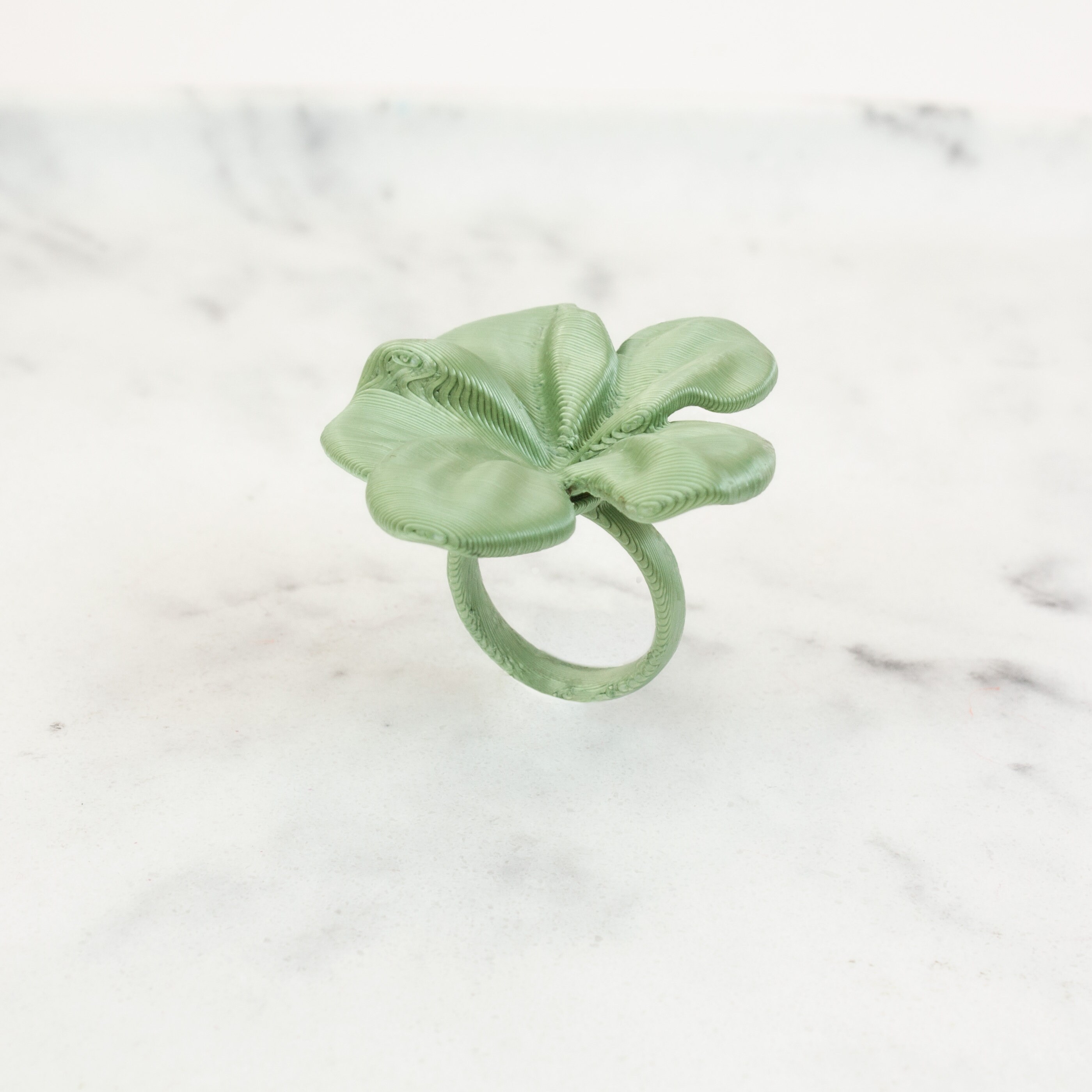 Hibis ring in the shape of a flower in Green Leaf, 3D printed, custom made, available in various colors.