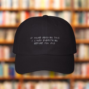 May include: Black baseball cap with a curved peak. The cap displays white text: "IF YOU'RE READING THIS I LIKED EVERYTHING BEFORE YOU DID." A classic style hat, suitable for casual wear.