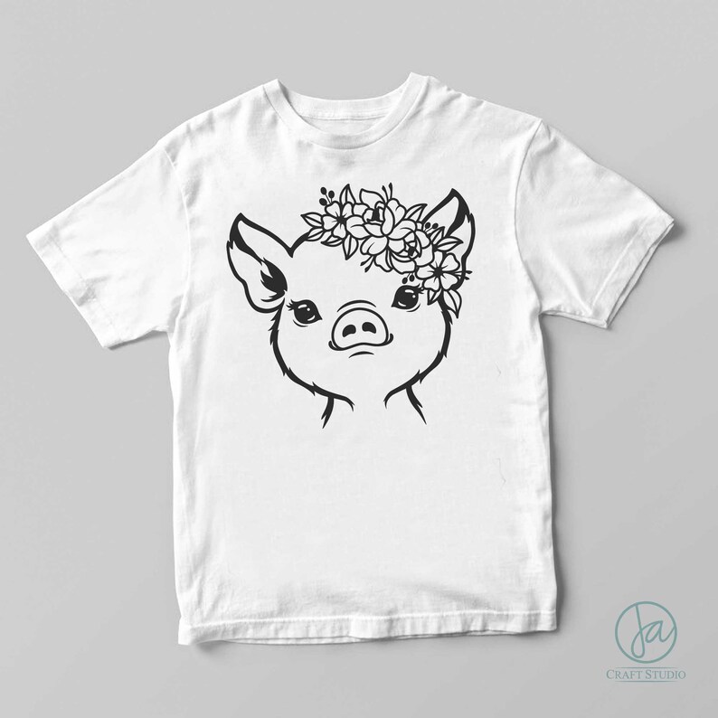 May include: A black and white illustration of a pig wearing a floral crown. The pig is looking directly at the viewer. The image is on a white t-shirt.