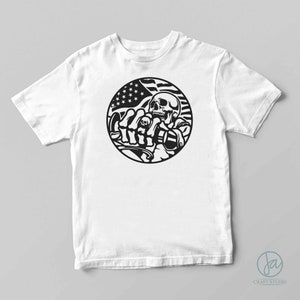 May include: White t-shirt with a black and white graphic of a skull riding a motorcycle with an American flag in the background.