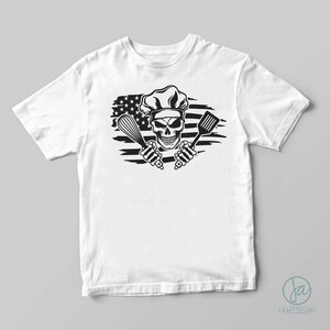 May include: White t-shirt with a black and white graphic of a skull wearing a chef's hat and holding a whisk and spatula. The skull is in front of a distressed American flag.