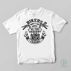 May include: White t-shirt with a black graphic design of a motorcycle with the text "Bikers Don't Go Grey We Turn Chrome".