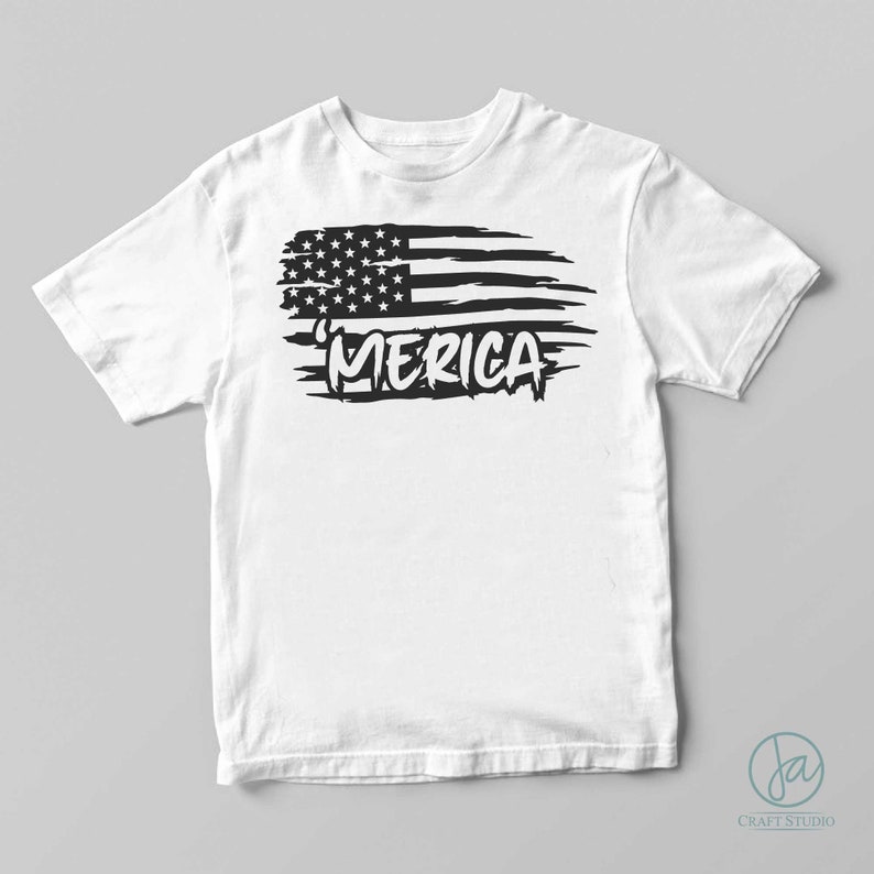 May include: White t-shirt with a black distressed American flag design and the word "MERICA" printed below it.