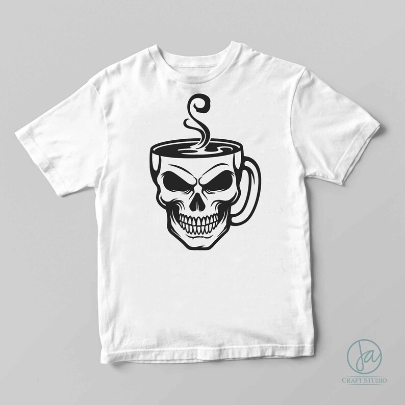 May include: A white t-shirt featuring a black and white illustration of a skull in a coffee cup with steam rising from the cup.