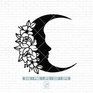 May include: Black and white silhouette of a crescent moon with a floral design. The moon is facing to the right and has a stylized face. The flowers are stylized and have a simple design.