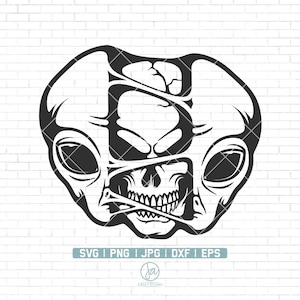 May include: Black and white graphic design featuring a skull with an alien-like head shape. The design includes the text "SVG | PNG | JPG | DXF | EPS" and the "JA Craft Studio" logo. The skull has large eye sockets and a detailed jawline.
