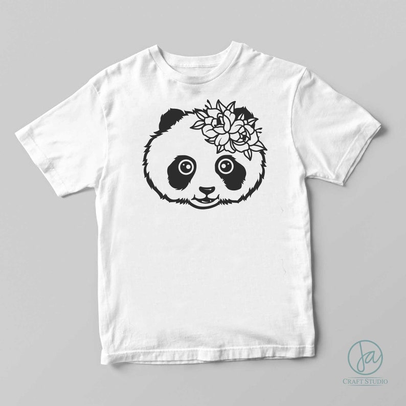 May include: A white t-shirt with a black and white illustration of a panda bear wearing a flower crown.