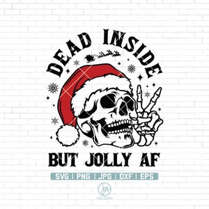May include: A black and white illustration of a skull wearing a red Santa hat and giving a peace sign. The text "Dead Inside But Jolly AF" is written around the skull.