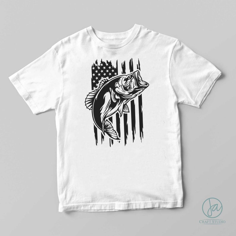 May include: A white t-shirt featuring a black and white graphic of a bass fish leaping in front of an American flag.