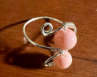 Silver wire ring with pink beads