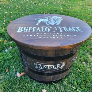 Custom whiskey barrel  table, liquor cabinet.