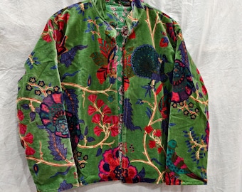 May include: Green velvet jacket with a vibrant floral pattern in red, blue, and pink. The jacket features a mandarin collar and a button closure. The design includes stylized flowers, leaves, and birds.