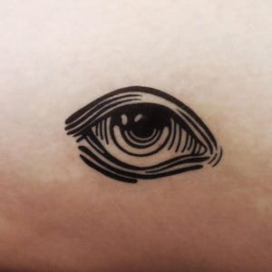 Vintage Old Man&#39;s Eye Temporary Tattoo: Mystical Halloween Body Art