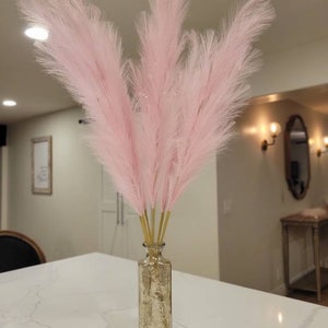 Fluffy light pastel pink pampas faux . Fake Pink pompass perfect for home decor, boho events, and even boho patio decor.