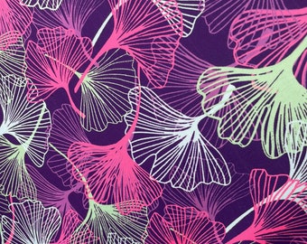 May include: Purple fabric with a repeating pattern of white and pink ginkgo leaves.