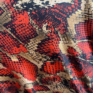 Snake print on nylon spandex four way stretch fabric sold by the yard available in 2 colors
