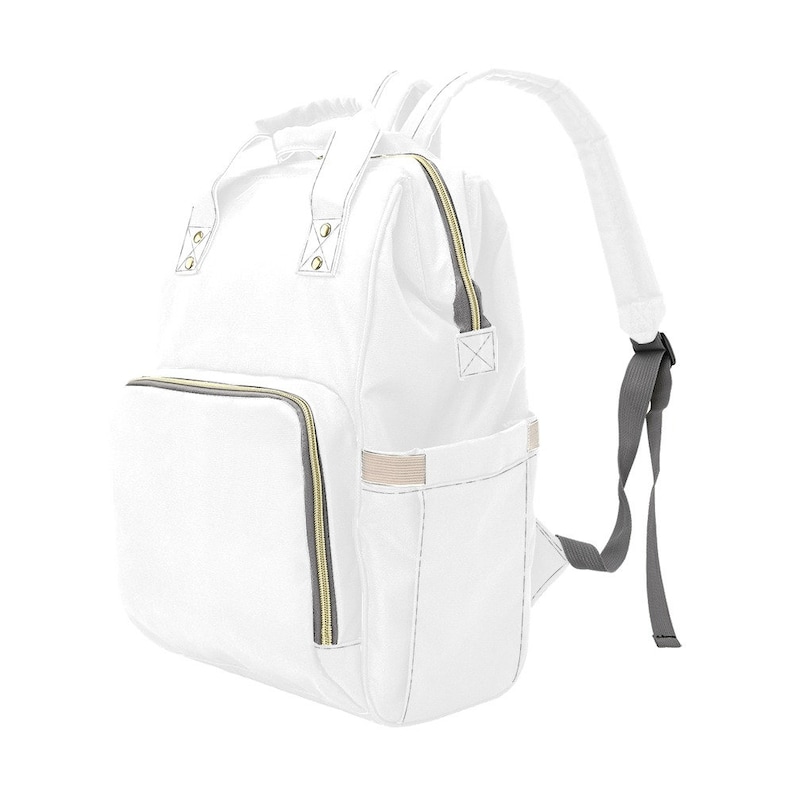 May include: A white diaper bag backpack with gold zippers and a gray strap. The bag has multiple pockets and compartments.