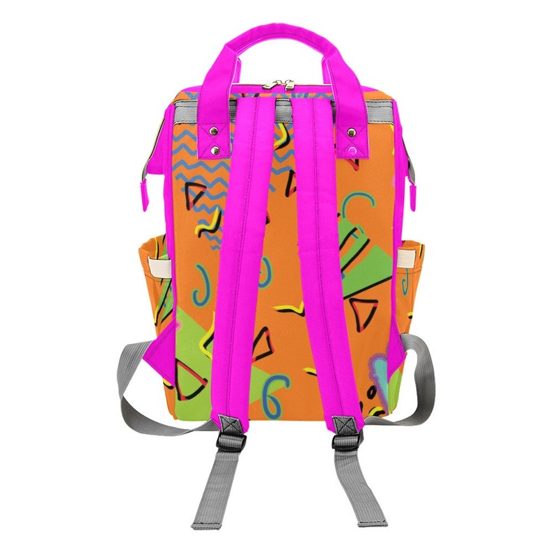 May include: A pink and orange backpack with a geometric pattern. The backpack has adjustable straps and a zip closure.