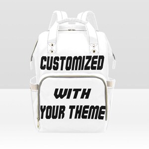 May include: White diaper bag backpack with black text that says "CUSTOMIZED WITH YOUR THEME".