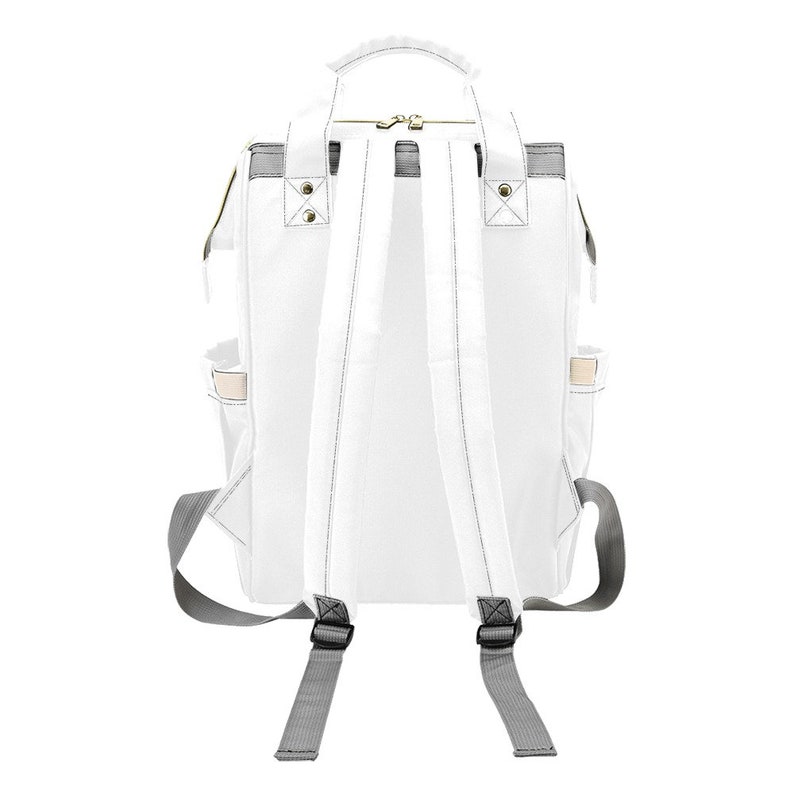 May include: White canvas backpack with gray adjustable straps and a zipper closure. The backpack has two side pockets and a small pocket on the front.