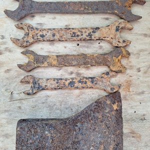Rusty metal objects. Rusty axes and wrenches . Rusty tools
