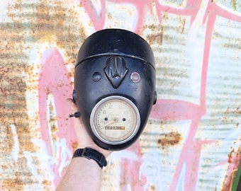 Vintage black motorcycle headlights with speedometer, natural rust on the headlight, steampunk decor element, idea for bar lighting