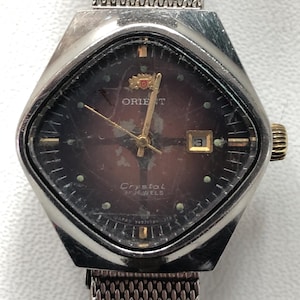 May include: A set of three ceramic mugs with a speckled, matte finish. The mugs are in shades of cream, light gray, and dark gray. Each mug has a simple, minimalist design, suitable for coffee or tea.