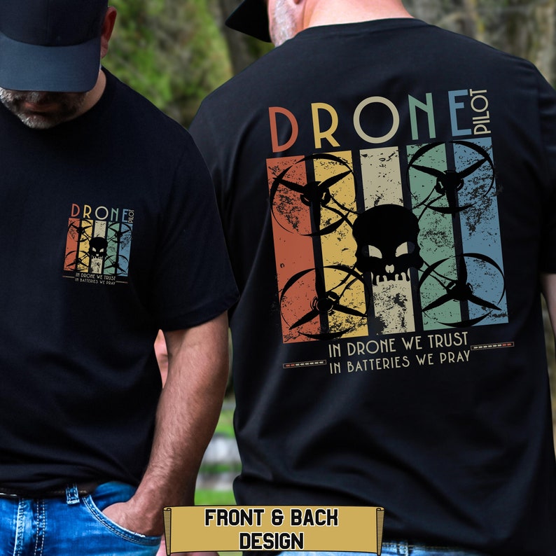 May include: Black t-shirt with a vintage-style graphic of a drone with a skull in the center. The text "Drone Pilot" is above the graphic and "In Drone We Trust, In Batteries We Pray" is below the graphic.