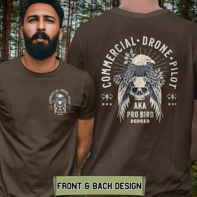 May include: A brown t-shirt with a graphic of a skull with an eagle perched on top. The text "Commercial Drone Pilot" is written in a circle around the graphic. The text "AKA Pro Bird Dodger" is written below the graphic.