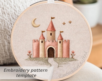 May include: Embroidered castle design in a wooden hoop. The castle features pink turrets, a beige facade, and a pathway leading to the arched doorway. A crescent moon and stars are embroidered above the castle. The text "Embroidery pattern template" is visible.