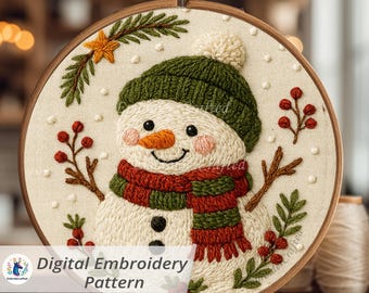 May include: A digital embroidery pattern of a snowman in a wooden hoop. The snowman has a green hat, red and green scarf, and an orange nose. The design includes a star, berries, and the text "Digital Embroidery Pattern".