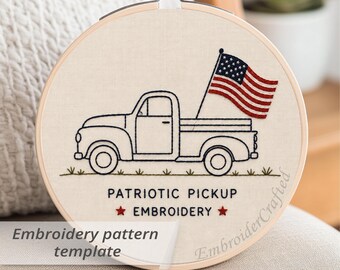 May include: Embroidery hoop featuring a black line drawing of a vintage pickup truck with an American flag in the truck bed. The text "PATRIOTIC PICKUP EMBROIDERY" is below the truck. The words "Embroidery pattern template" are in the lower left.