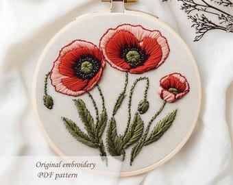 May include: Embroidered poppy flowers in a wooden hoop. The red and pink petals contrast with the green leaves and stems. The text "Original embroidery PDF pattern" is visible.