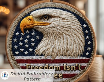 May include: A digital embroidery pattern featuring a detailed bald eagle head with a yellow beak and piercing gaze. The design incorporates the American flag with red and white stripes and a blue field of stars. The text "Freedom Isn't Free" is embroidered below.