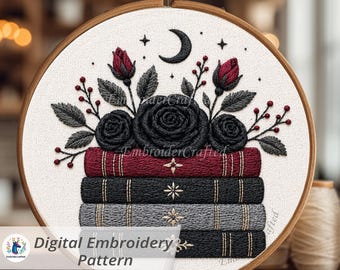 May include: An embroidery hoop featuring a floral design with black roses, red buds, and a crescent moon. The design is above a stack of embroidered books. The text "Digital Embroidery Pattern" is visible.