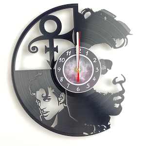 Vinyl Record Wall Clock designed with music lovers in mind, this unique timepiece features the iconic Purple Rain album cover