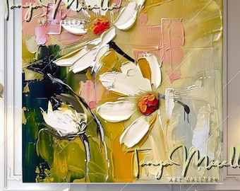 May include: An abstract oil painting on canvas featuring thick, textured impasto brushstrokes of white flowers with vibrant orange centers. The composition includes layers of gold, yellow, pink, and deep green paint, with the text Tanya Mirella Art Gallery.