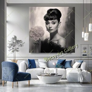 May include: Black and white portrait of a woman holding flowers. The artwork features a classic Hollywood style, with a focus on the subject's elegant features and hairstyle. The image is displayed on a large canvas, suitable for home decor.