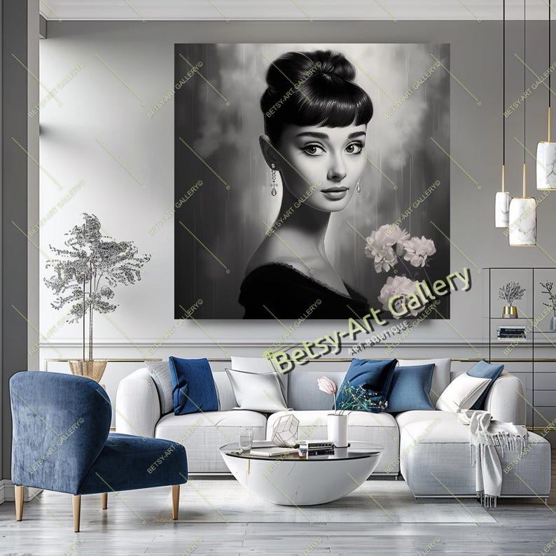 May include: Black and white portrait of a woman with dark hair in a bun, wearing a black dress and dangling earrings, holding white flowers. The artwork is displayed on a wall in a living room setting. The text "Betsy Art Gallery" is visible.
