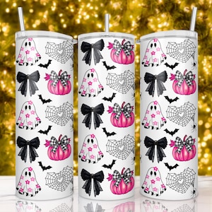May include: Three white stainless steel tumblers with a Halloween themed design. The design features pink and black bows, ghosts, bats, and spiderwebs.